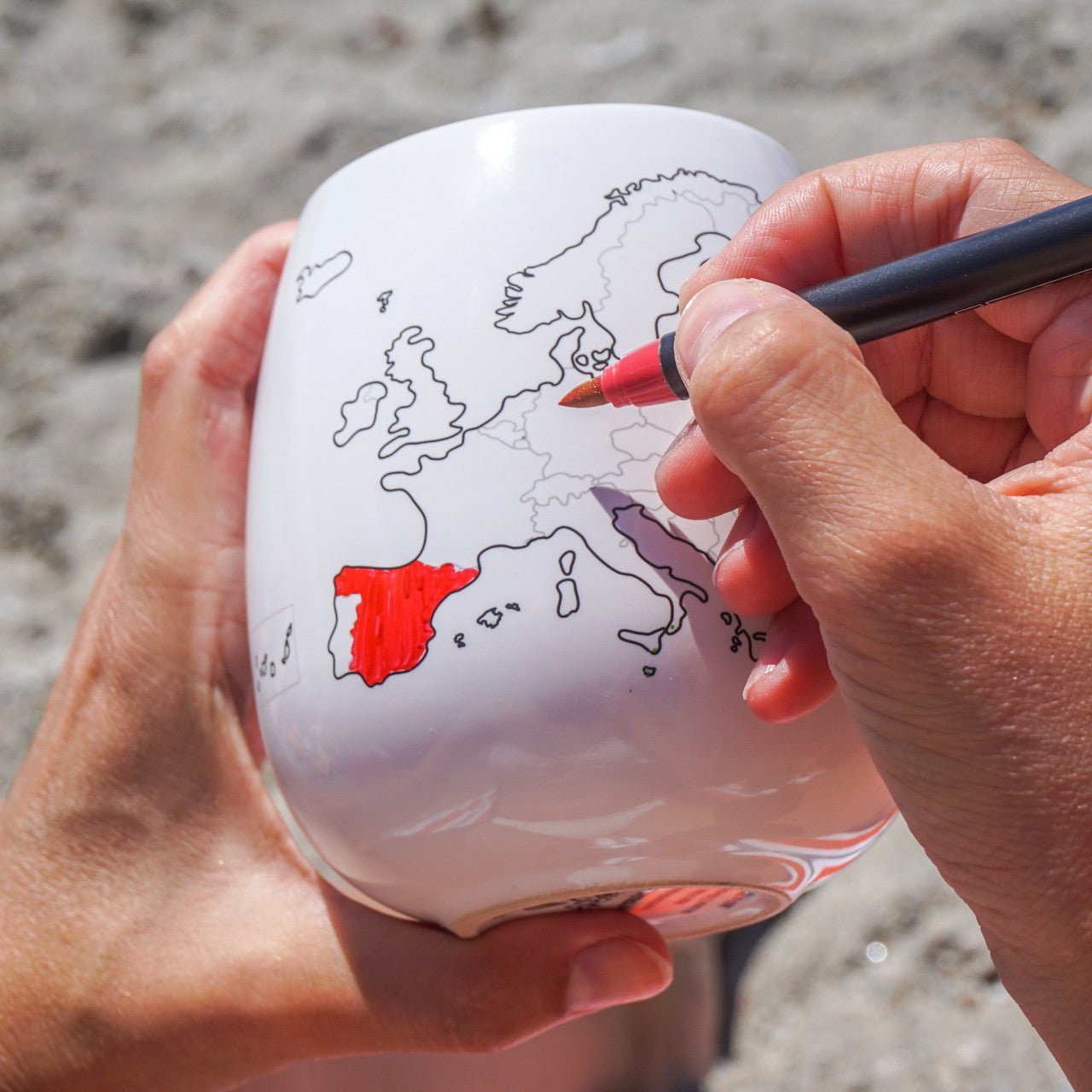 Europe map colour-in travel mug by Trouvaille featuring a ceramic mug with a Europe map outline and a pen for colouring.