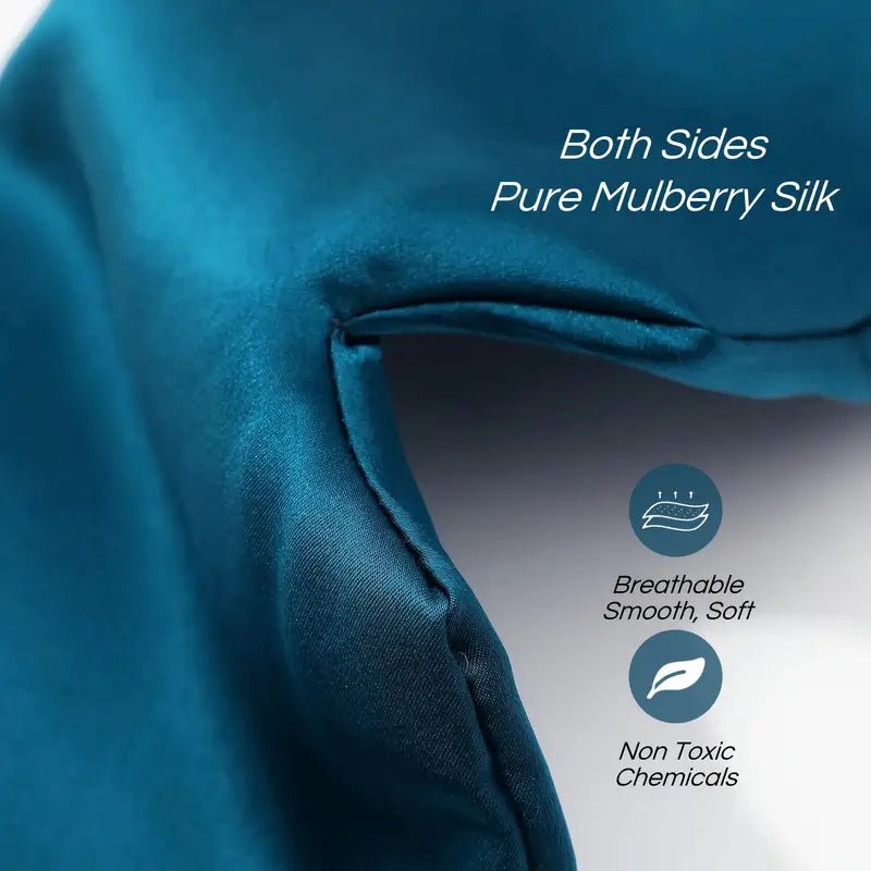 Black silk sleep mask from DREAMSILK with a smooth, luxurious fabric and elastic strap for complete blackout and comfortable sleep.