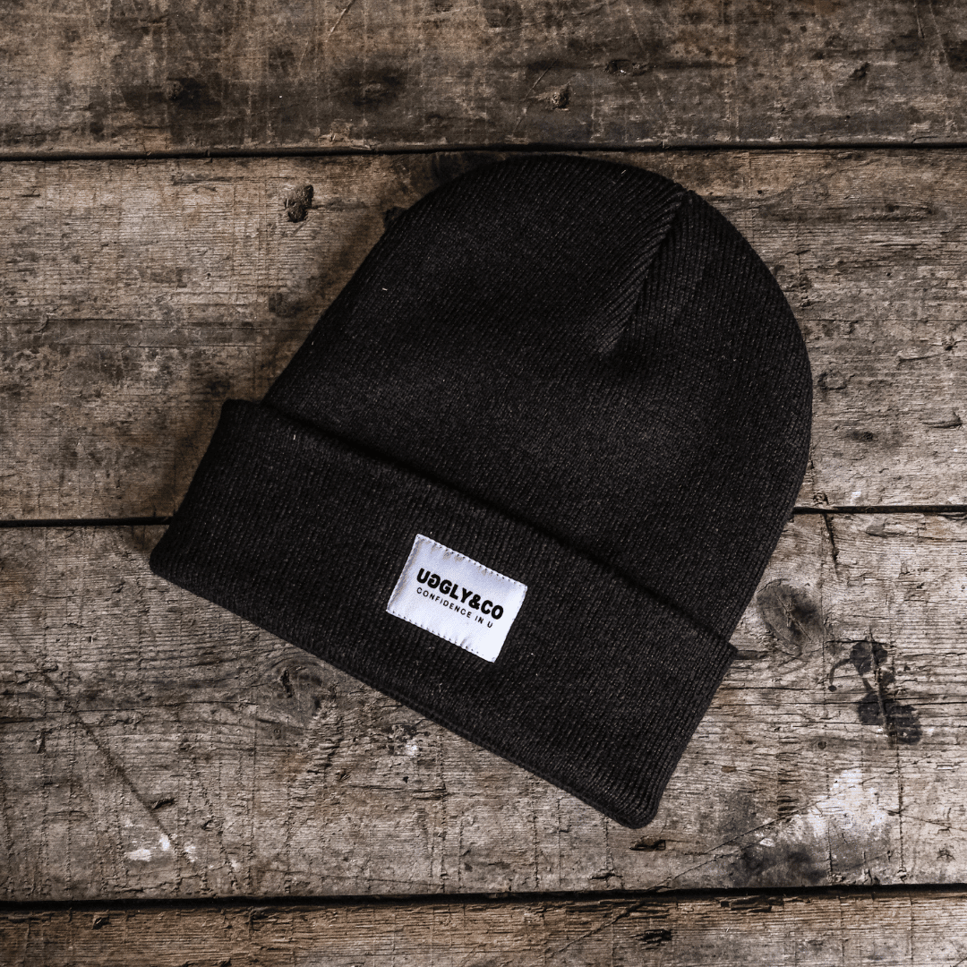 Uggly and Co Davey Todd 74 beanie featuring a cozy knit design and bold logo embroidery, perfect for casual winter wear.