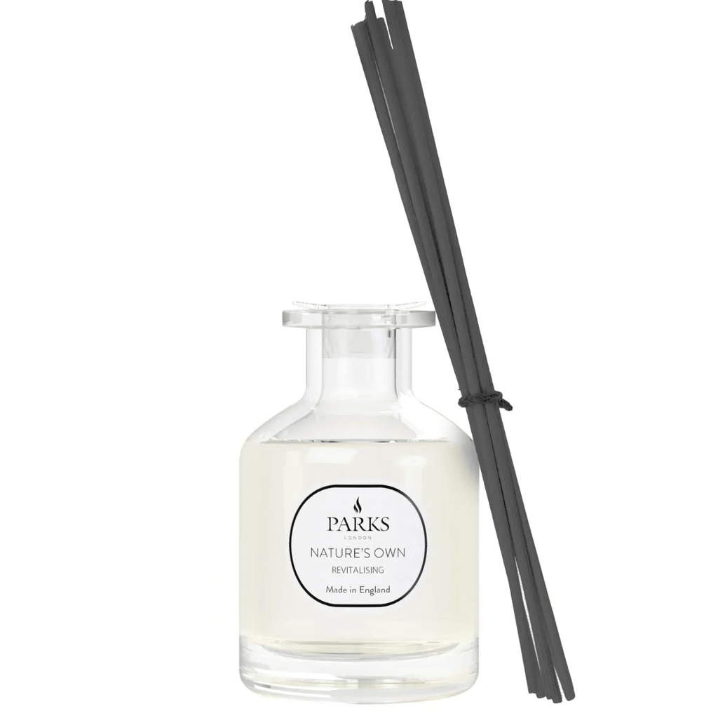 Reed diffuser labeled "Revitalising" by Parks Candles in a 100ml glass bottle with reeds for home fragrance.