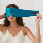 Black silk sleep mask by DREAMSILK, designed for blackout sleep and comfortable wear, with a smooth, luxurious finish.