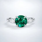 Emerald & Moissanite Three Stone Engagement Ring in Sterling Silver