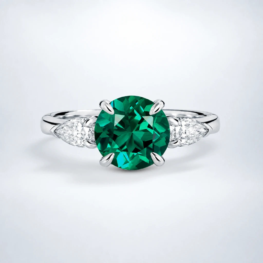 Emerald & Moissanite Three Stone Engagement Ring in Sterling Silver