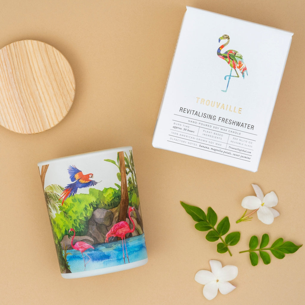Freshwater soy scented candle by Trouvaille with eco-friendly packaging, showcasing a tropical-inspired design for revitalizing ambiance.