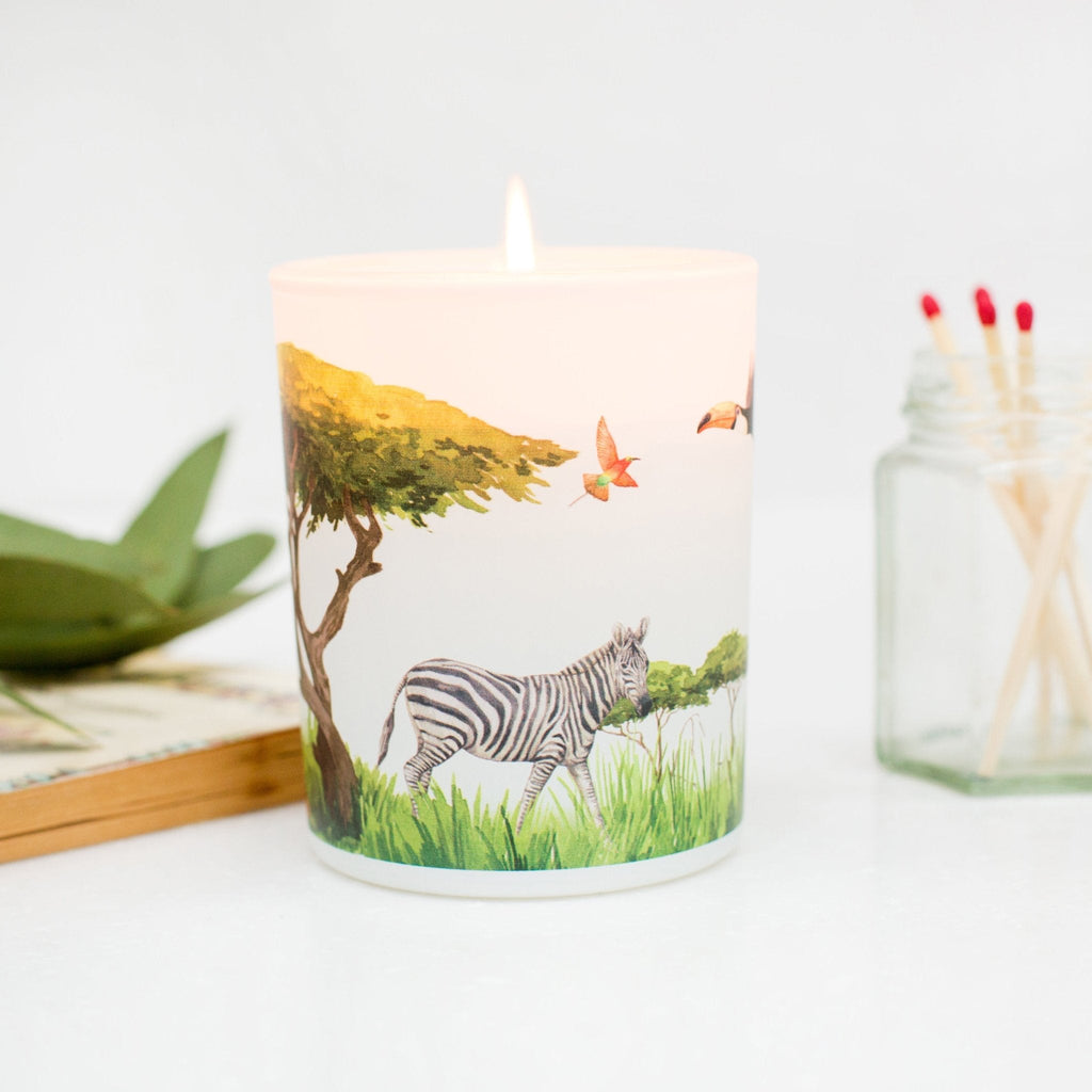 Trouvaille Grassland Soy Scented Candle with uplifting citrus scent, featuring a zebra-patterned container and natural soy wax.