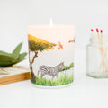 Trouvaille Grassland Soy Scented Candle with uplifting citrus scent, featuring a zebra-patterned container and natural soy wax.