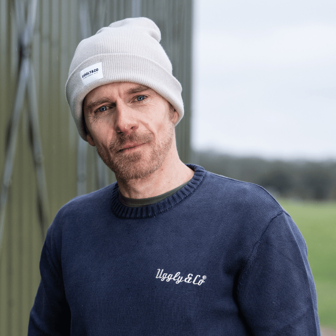 Oatmeal grey Uggly and Co beanie with a soft knit texture, suitable for casual wear and colder weather.