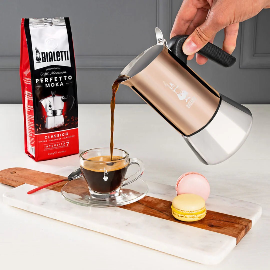 Bialetti Venus stovetop coffee maker with induction-compatible stainless steel, featuring a polished silver finish and ergonomic handle.
