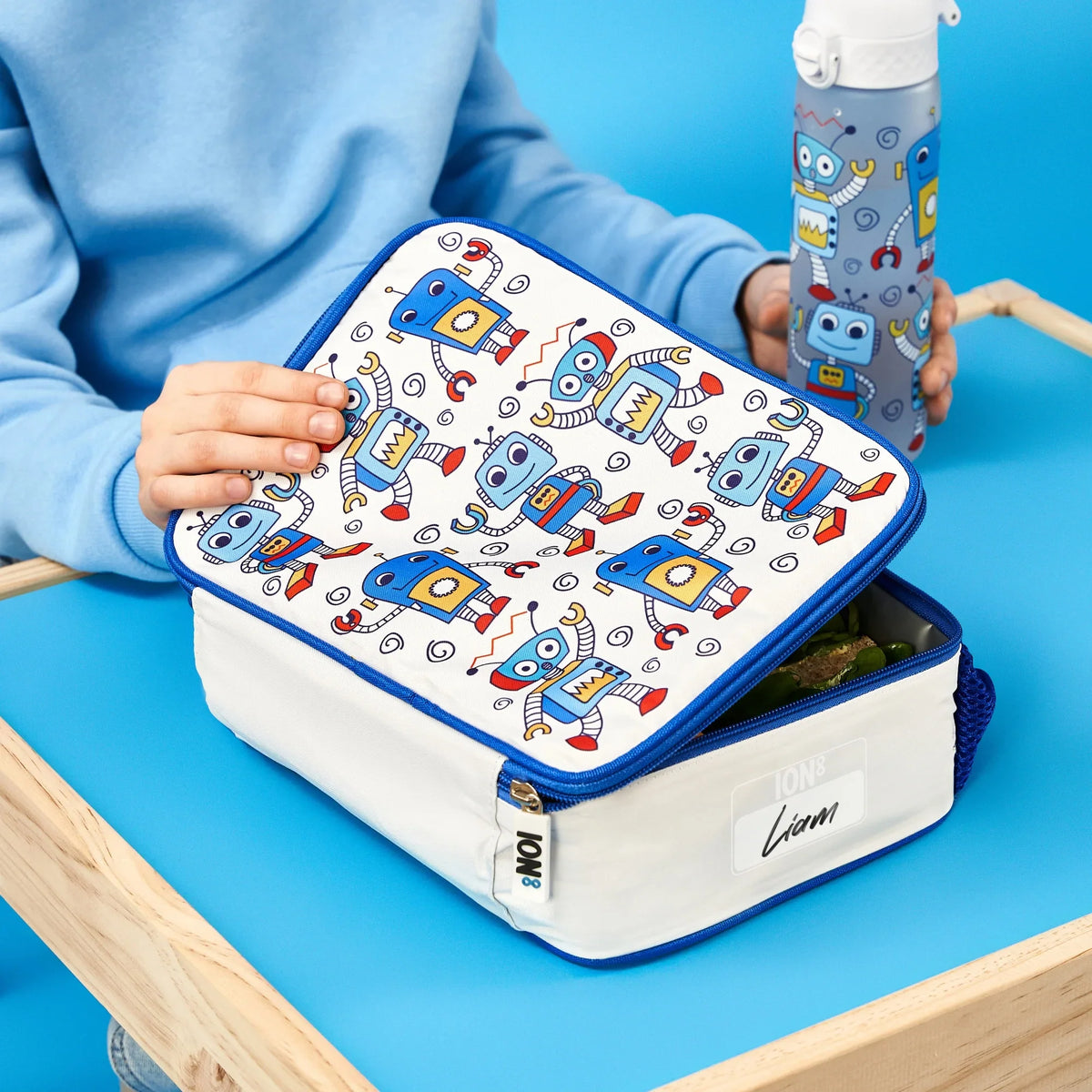 Kids insulated lunch bag featuring robot design by ION8, with a spacious, insulated compartment for keeping food fresh.