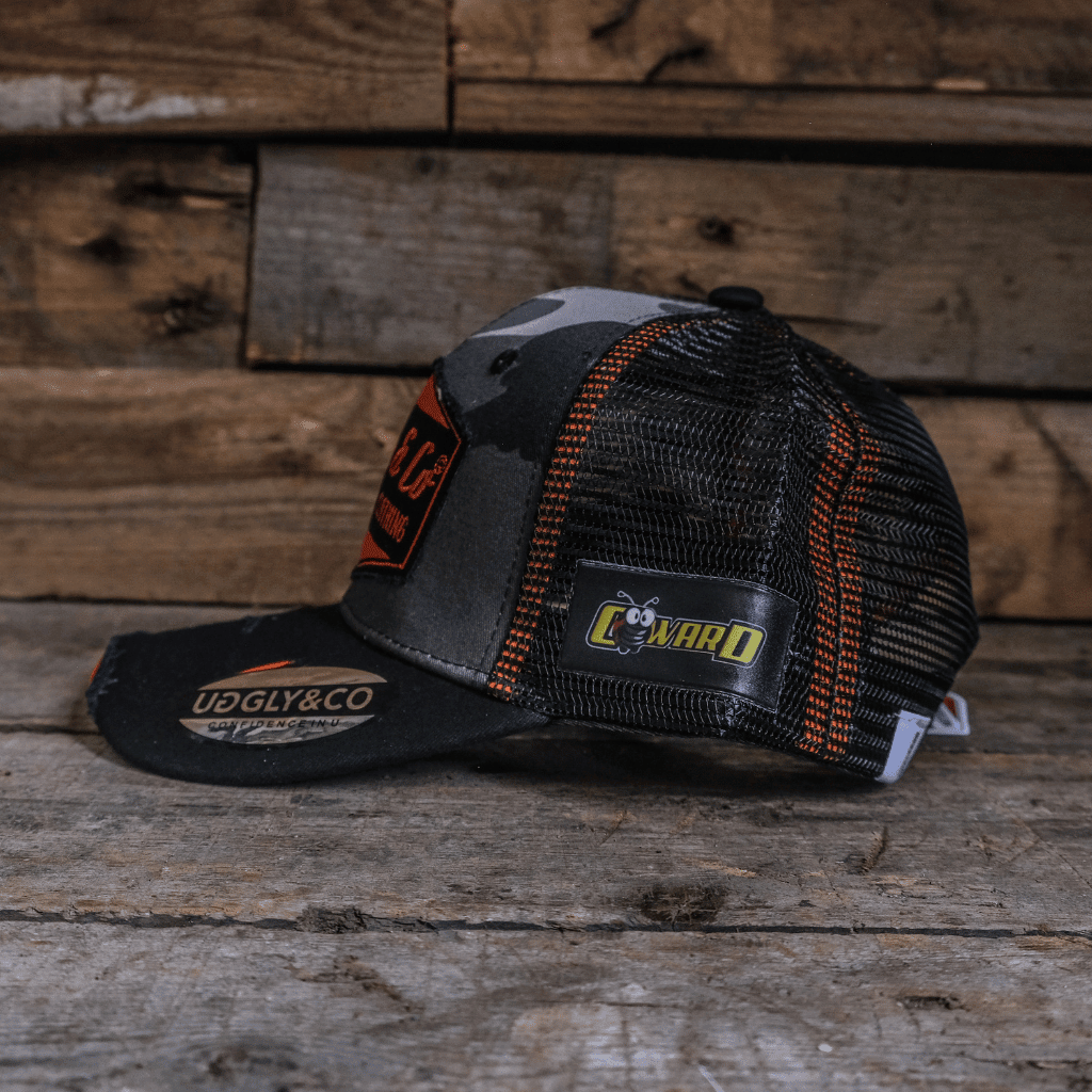 Grey camo diamond trucker cap by Uggly and Co featuring a classic mesh back and adjustable snap closure.