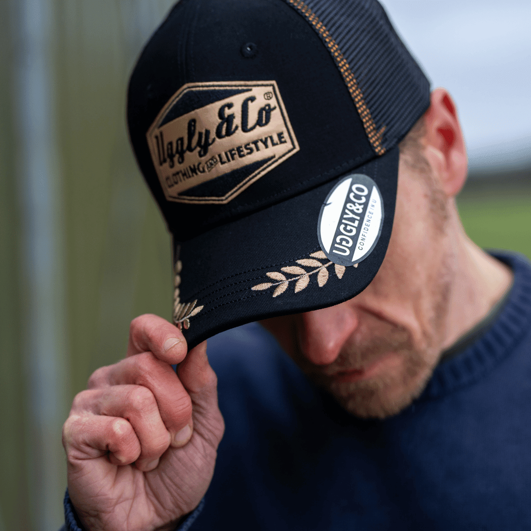 Black and gold 'Podium' diamond trucker hat by Uggly and Co, casual men's cap with a garage-inspired style and mesh back.