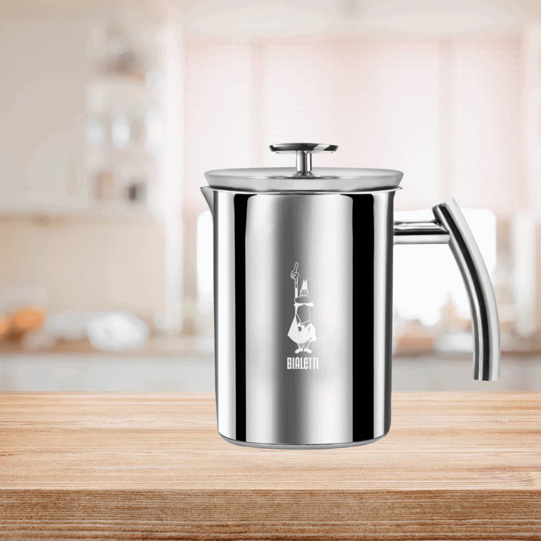 Bialetti Brew Italia manual milk frother with stainless steel body and ergonomic handle for creamy frothed milk.