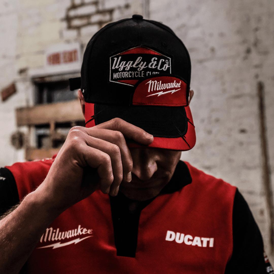 Uggly and Co Diamond Trucker Hat with Milwaukee Tools logo, featuring a classic baseball cap style and mesh back design.