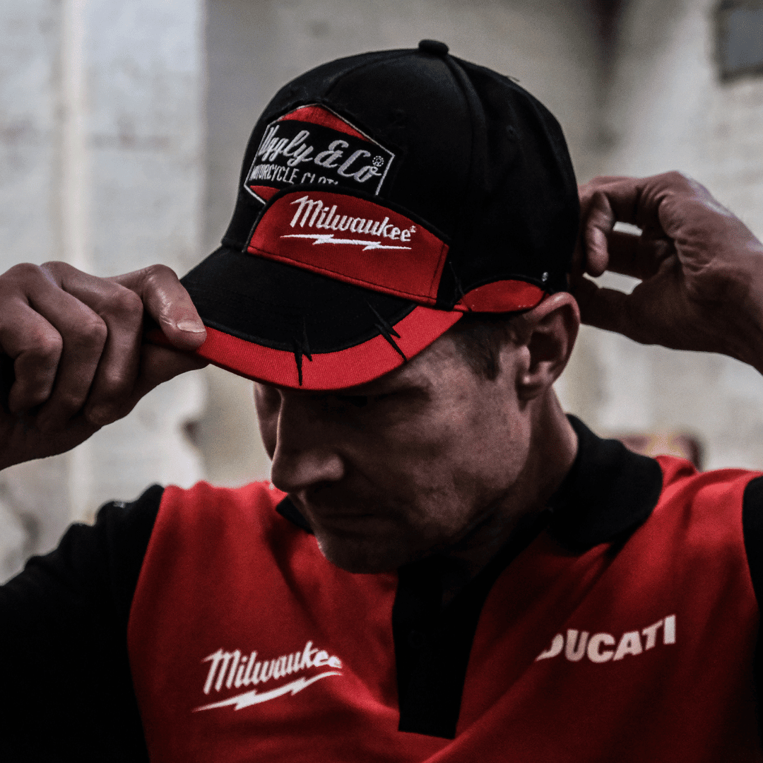 Uggly and Co diamond trucker hat featuring Milwaukee Tools® branding, with a mesh back and structured baseball cap design.