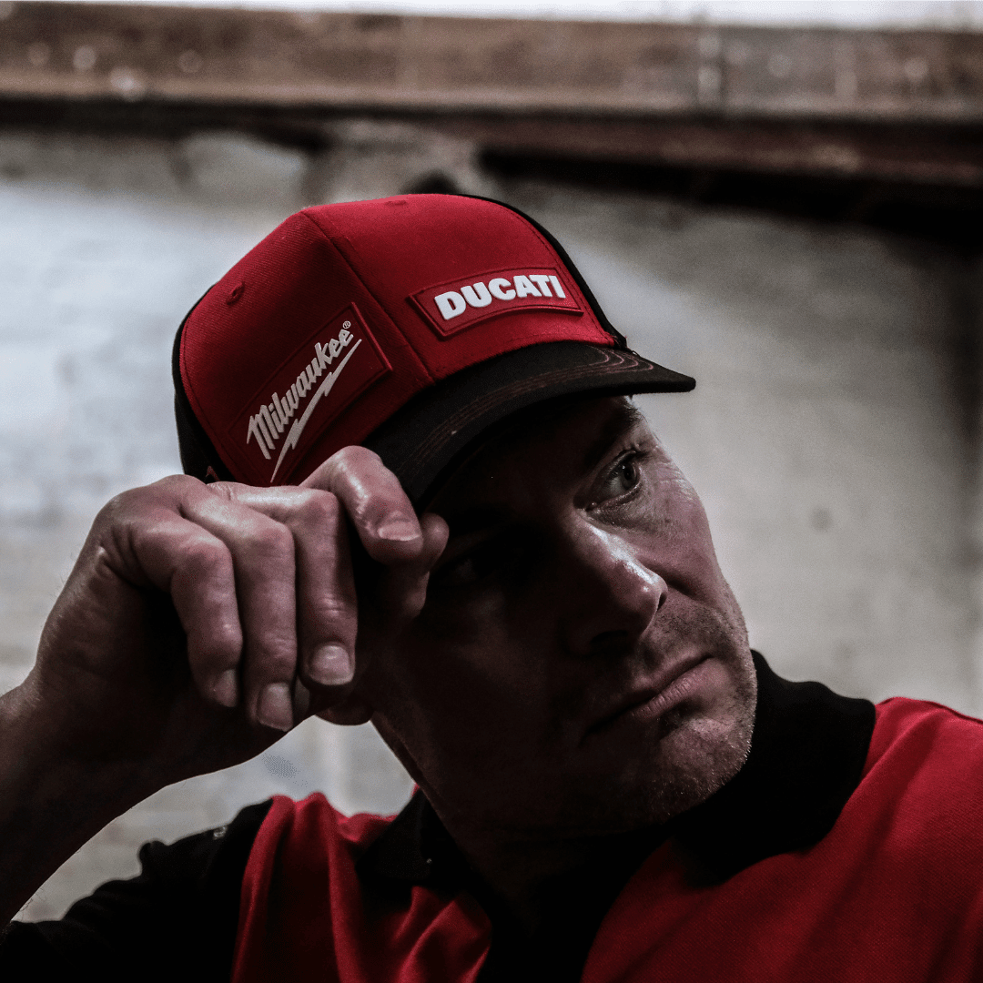Milwaukee Tools x Ducati team-wear trucker hat featuring a baseball cap design with Milwaukee and Ducati branding.