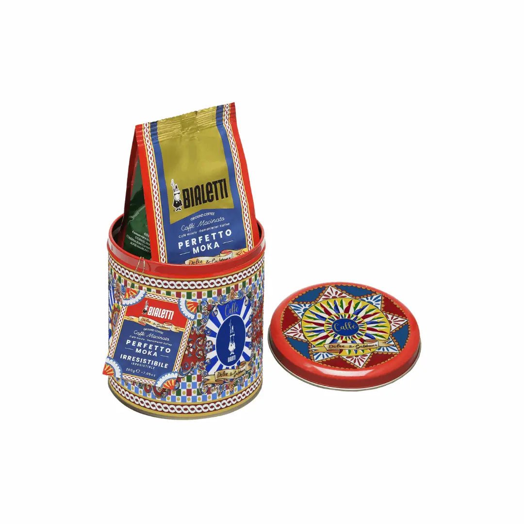 Bialetti Moka 3-cup coffee maker and Dolce&Gabbana Sicilian Cart gift set with coffee tin, featuring vibrant design and Italian craftsmanship.