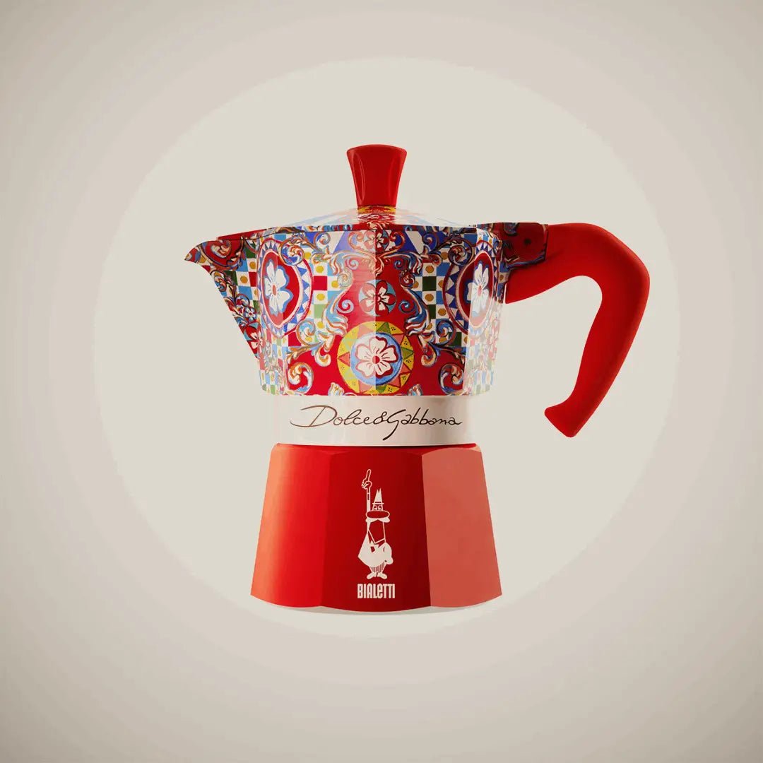 Bialetti Sicilian Cart Moka Express 3-cup coffee maker with Dolce&Gabbana design, black handle, and stainless steel body.