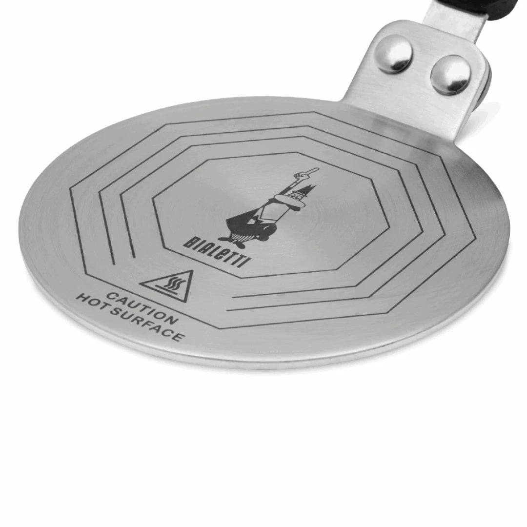 Bialetti Brew Italia induction converter plate for moka express coffee makers, flat black metal surface with Bialetti branding.