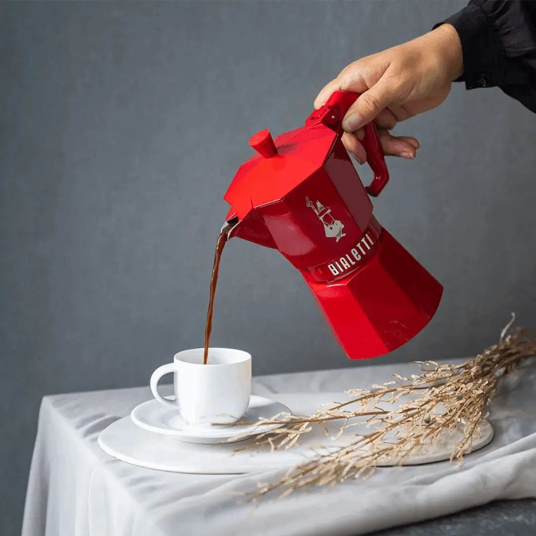 Red Bialetti Moka Express Exclusive moka pot by Brew Italia, 6-cup size, with sleek design and polished finish.