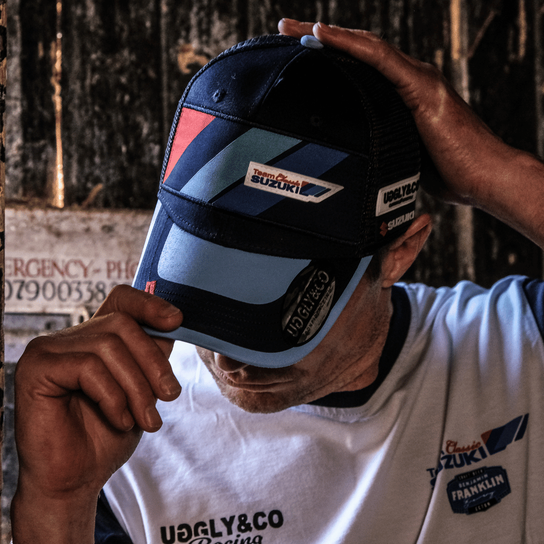 Uggly and Co Team Classic Suzuki Trucker Cap featuring a motorcycle-themed design on a casual trucker hat.