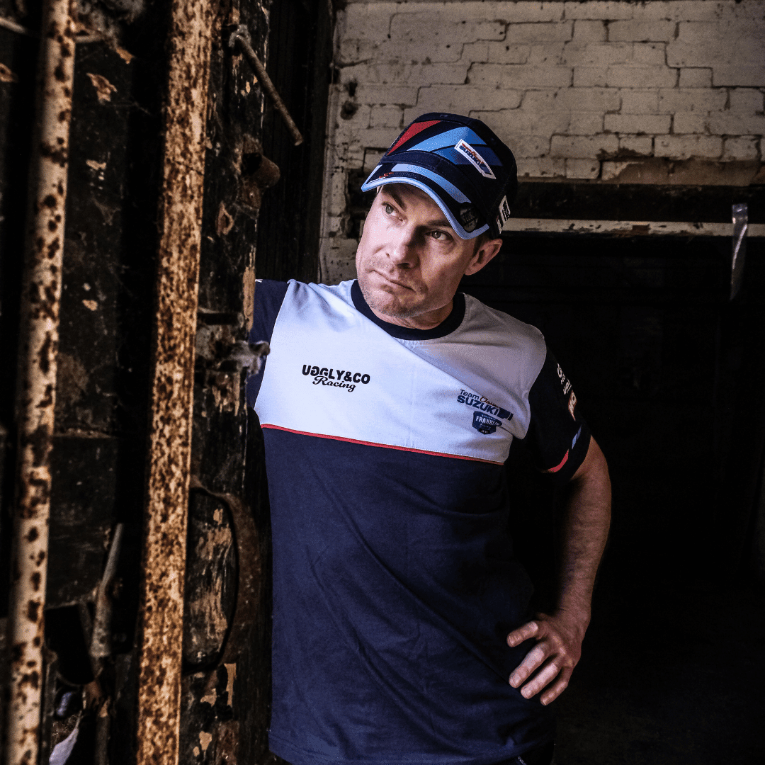 Uggly and Co Team Classic Suzuki Trucker Cap featuring a mesh back and embroidered Suzuki logo on the front.