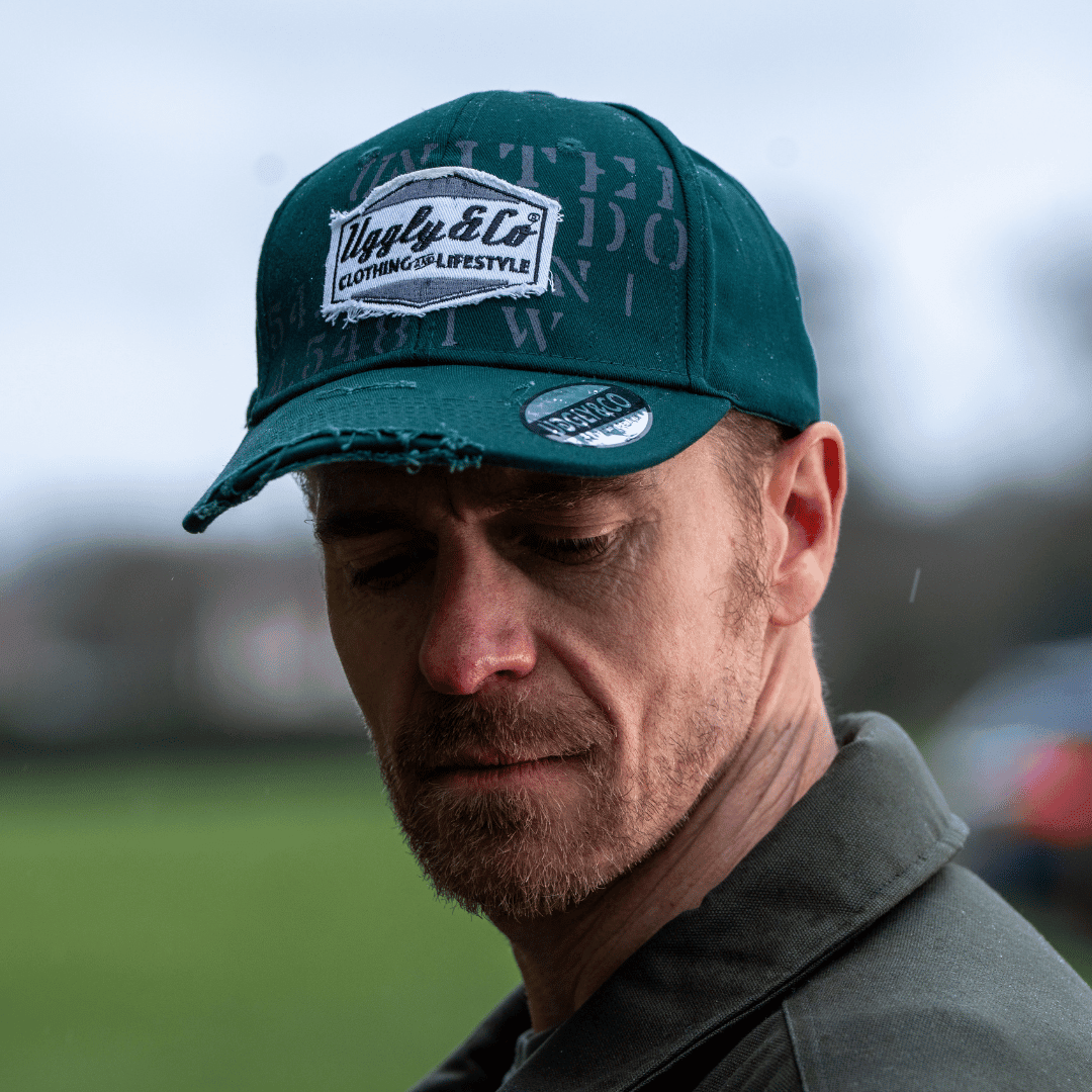 Green Uggly and Co Aviation diamond trucker hat featuring a breathable mesh back and curved brim for casual motorcycle lifestyle style.