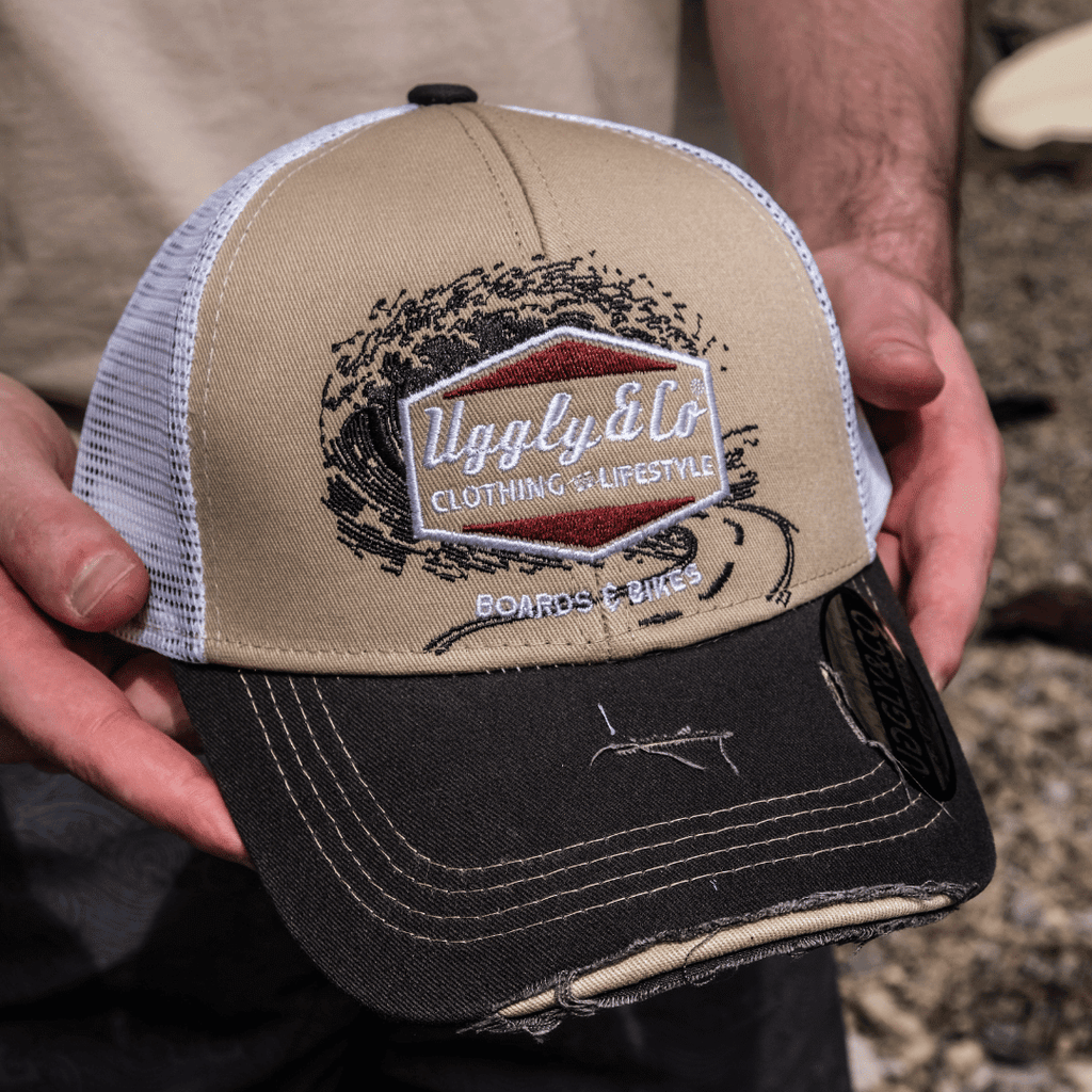 Beige Surf Diamond Uggly and Co trucker cap with motorcycle-style design and mesh back, casual sun hat for outdoor wear.