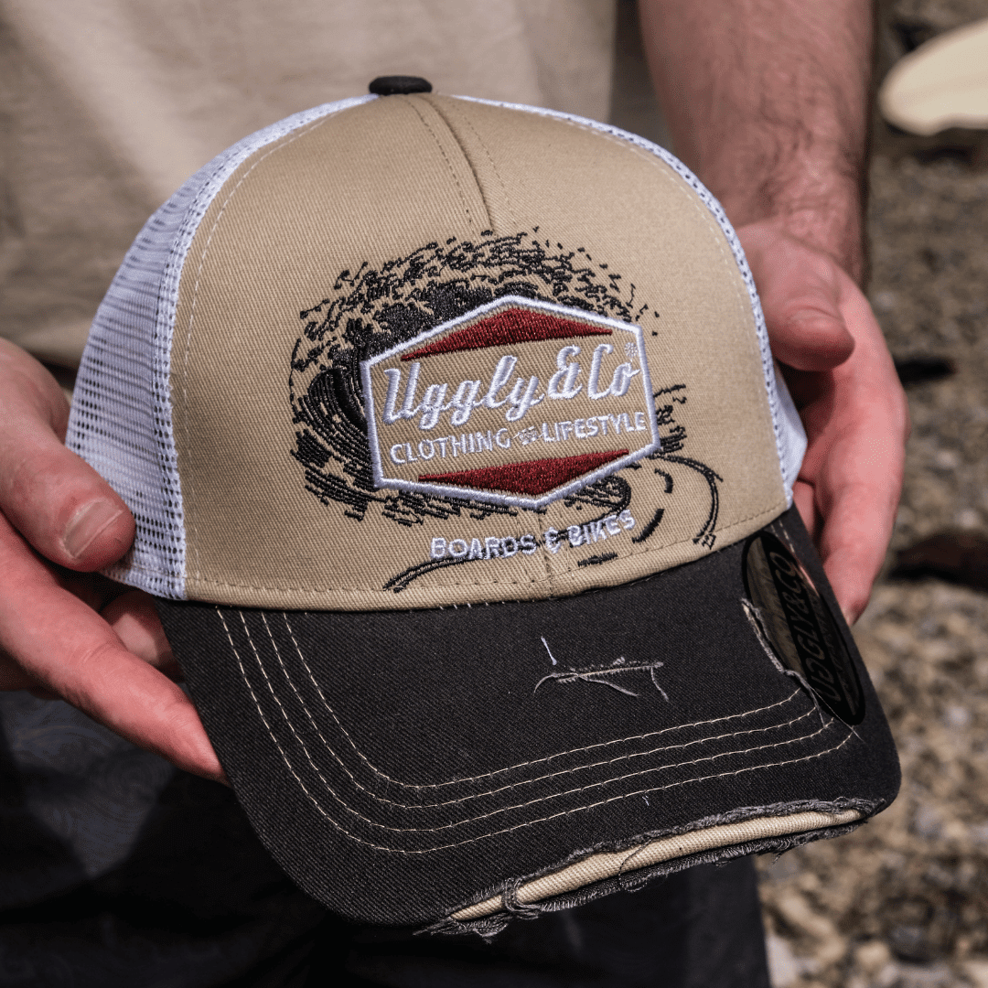 Beige Surf Diamond Uggly and Co trucker cap with motorcycle-style design and mesh back, casual sun hat for outdoor wear.