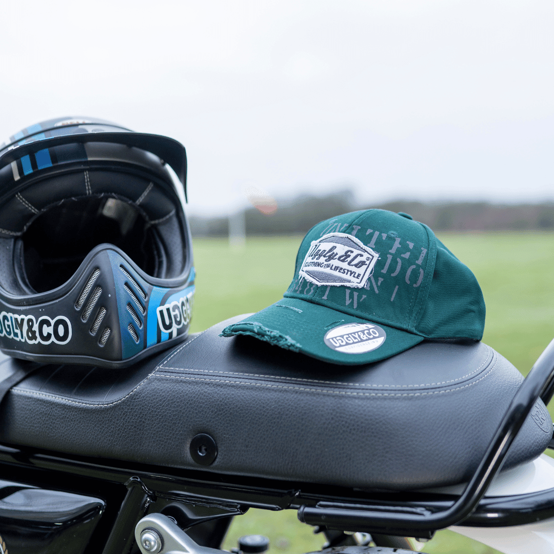 Green Uggly and Co Aviation Diamond Trucker Hat featuring vintage-style baseball cap design with embroidered aviation motif.