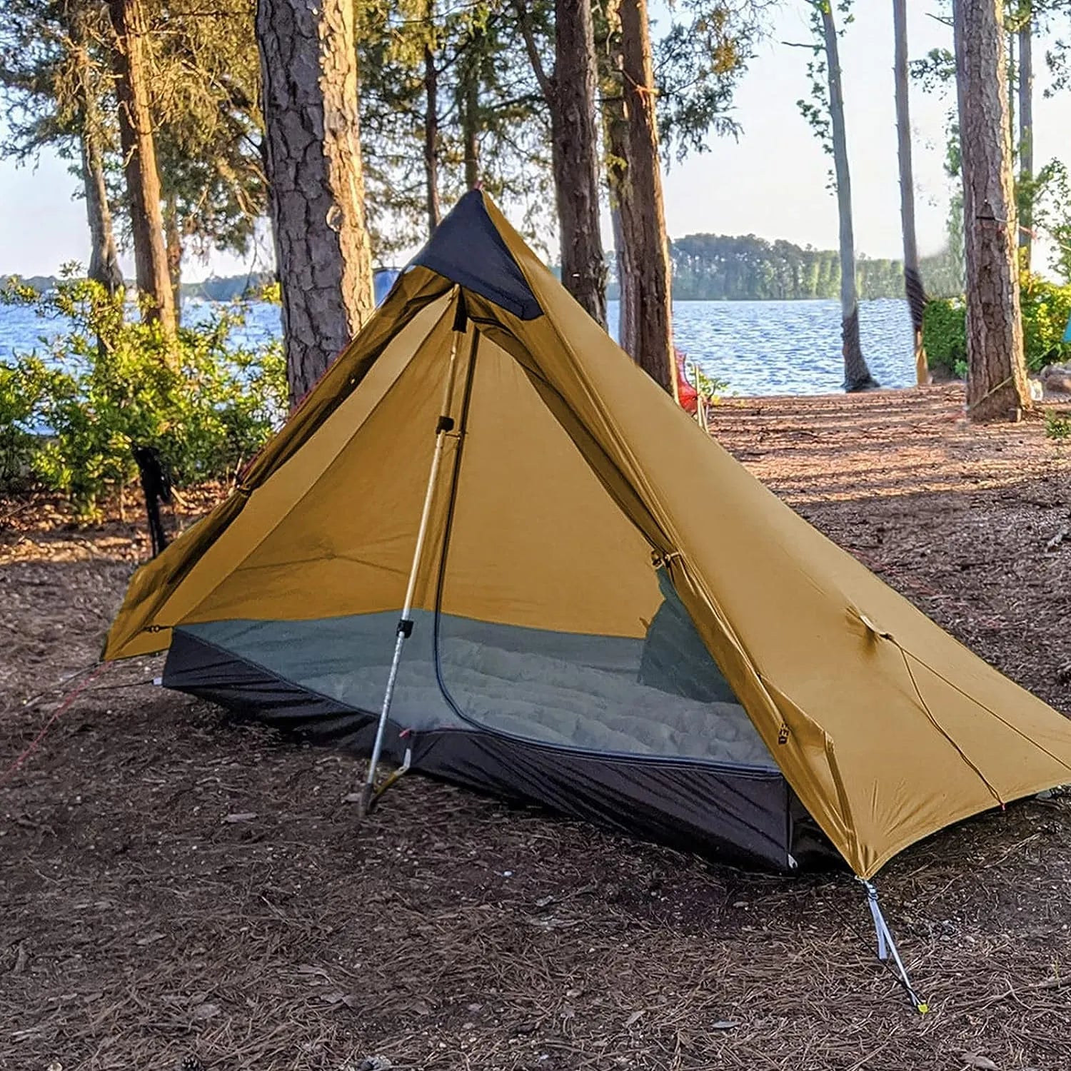 HikeWare Night Cat 1 Person Ultra Lightweight Backpacking Tent set up outdoors with rainfly and mesh sides for ventilation.