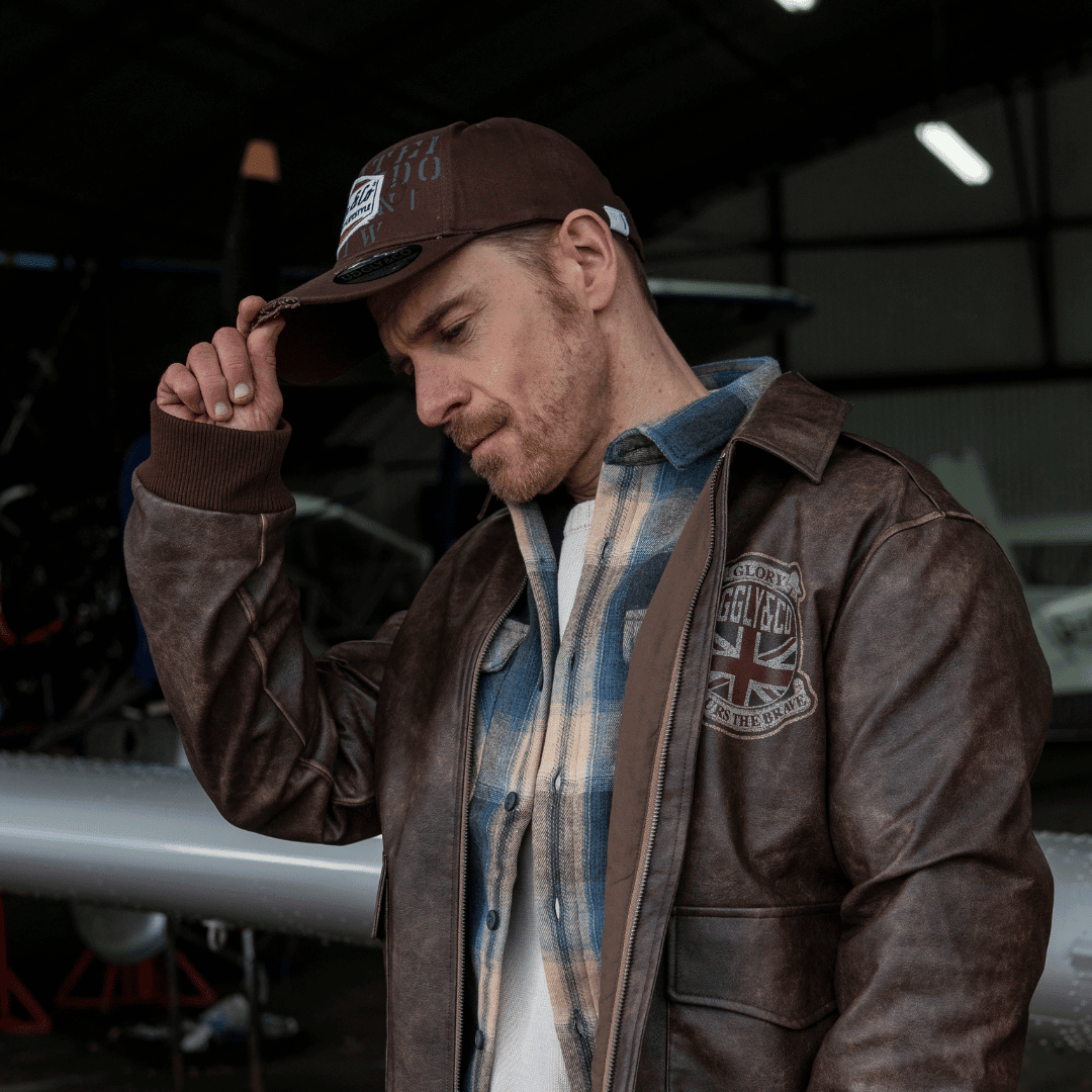 Brown Uggly and Co Aviation Diamond Trucker Hat with vintage motorcycle-inspired design and classic mesh back.