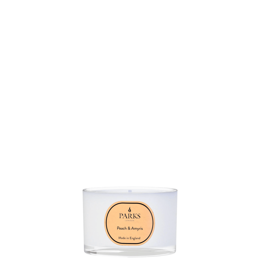 Parks Candles Peach & Amaryllis Travel Candle 70g, decorative candle in a glass container with peach and floral scent.