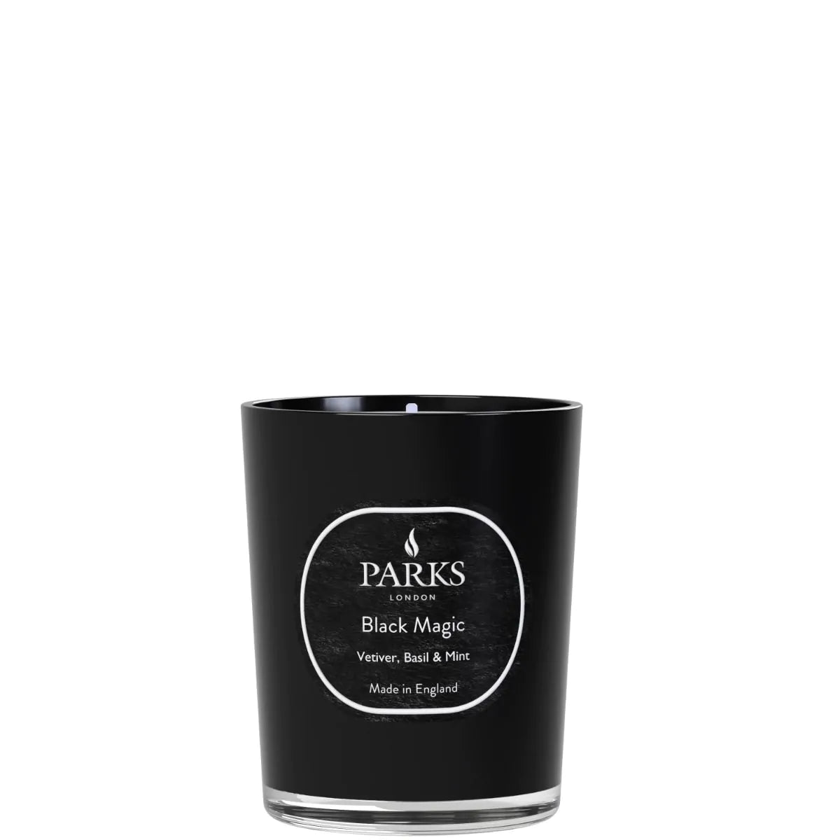 Parks Candles vetiver, basil, and mint scented candle in a 180g glass jar, with a lit wick and fresh herbal fragrance.