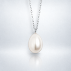 Large freshwater pearl pendant necklace in sterling silver with soft shadow and reflection, showcasing elegant jewelry design.