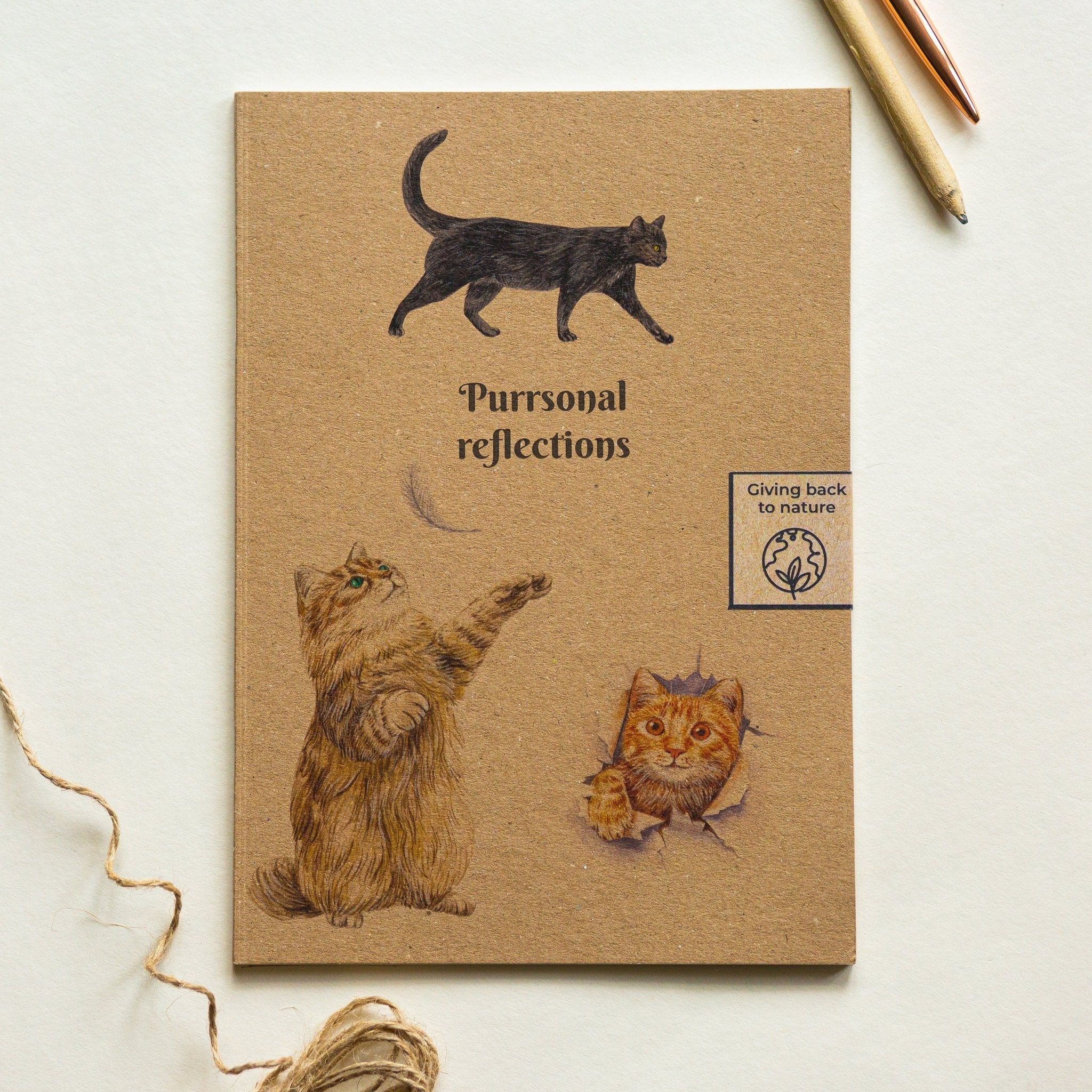 Trouvaille recycled paper notebook with illustrated cat cover, featuring a whimsical design for personal reflections and note-taking.