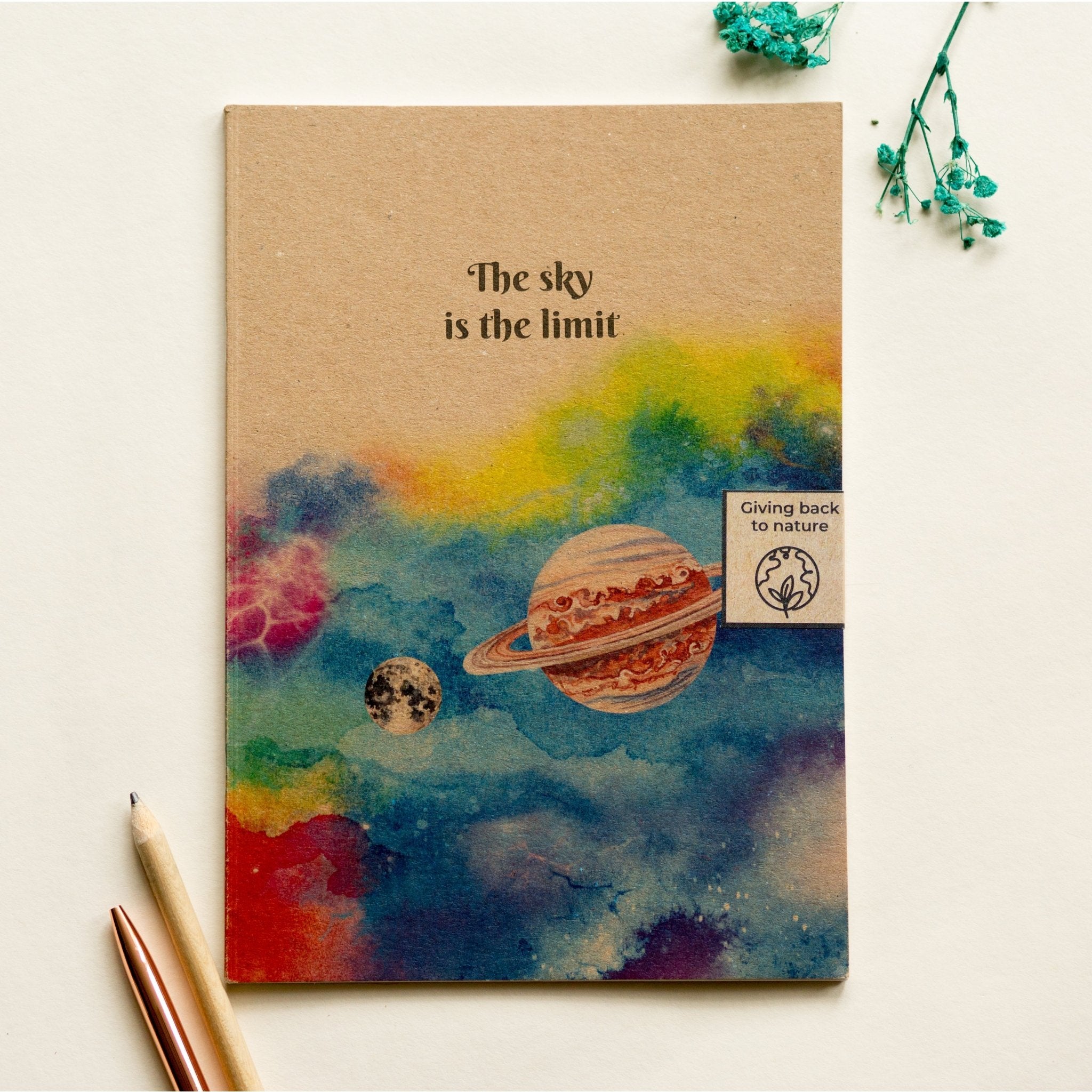 Trouvaille recycled paper notebook with illustrated galaxy sky cover, showcasing eco-friendly design and artistic celestial artwork.