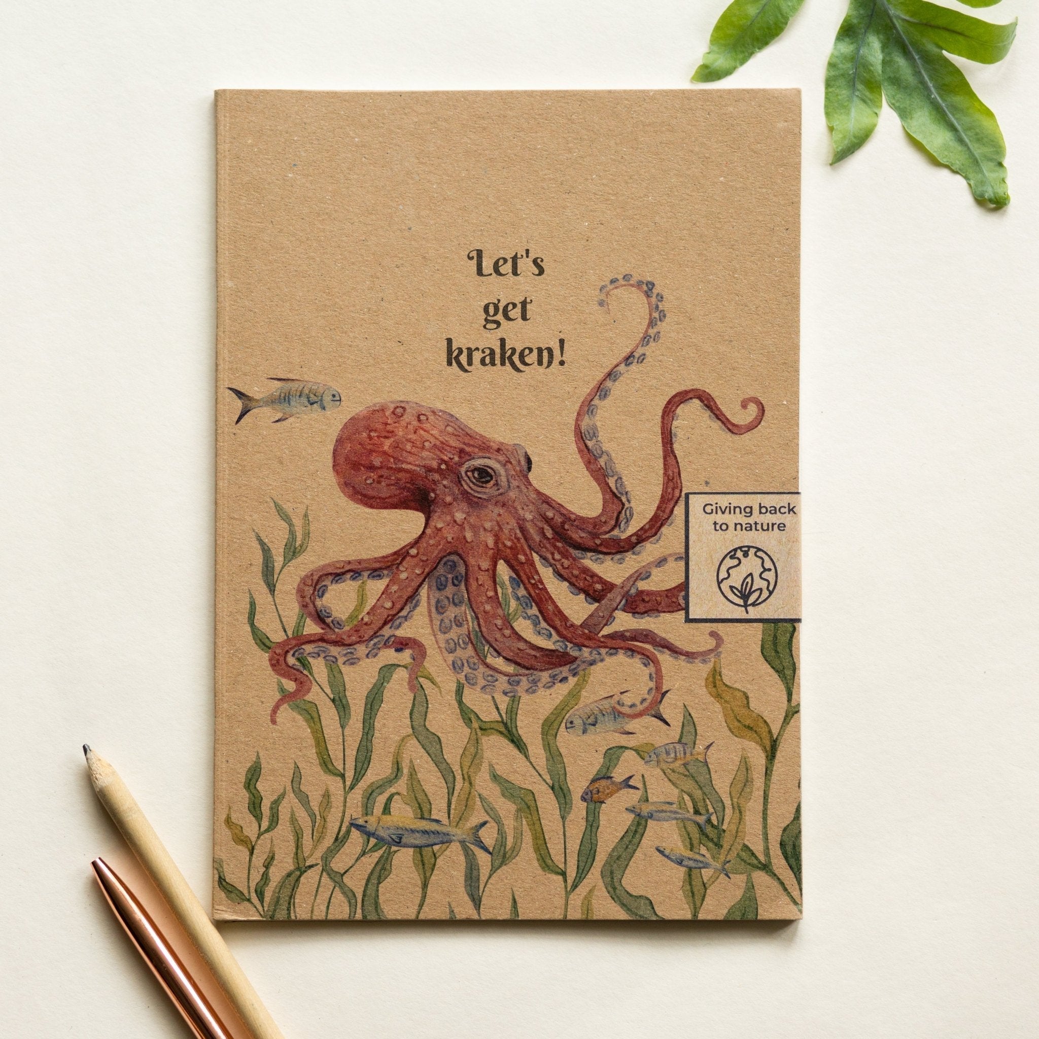 Trouvaille recycled paper notebook with illustrated octopus cover, featuring vibrant ocean-themed artwork and eco-friendly design.