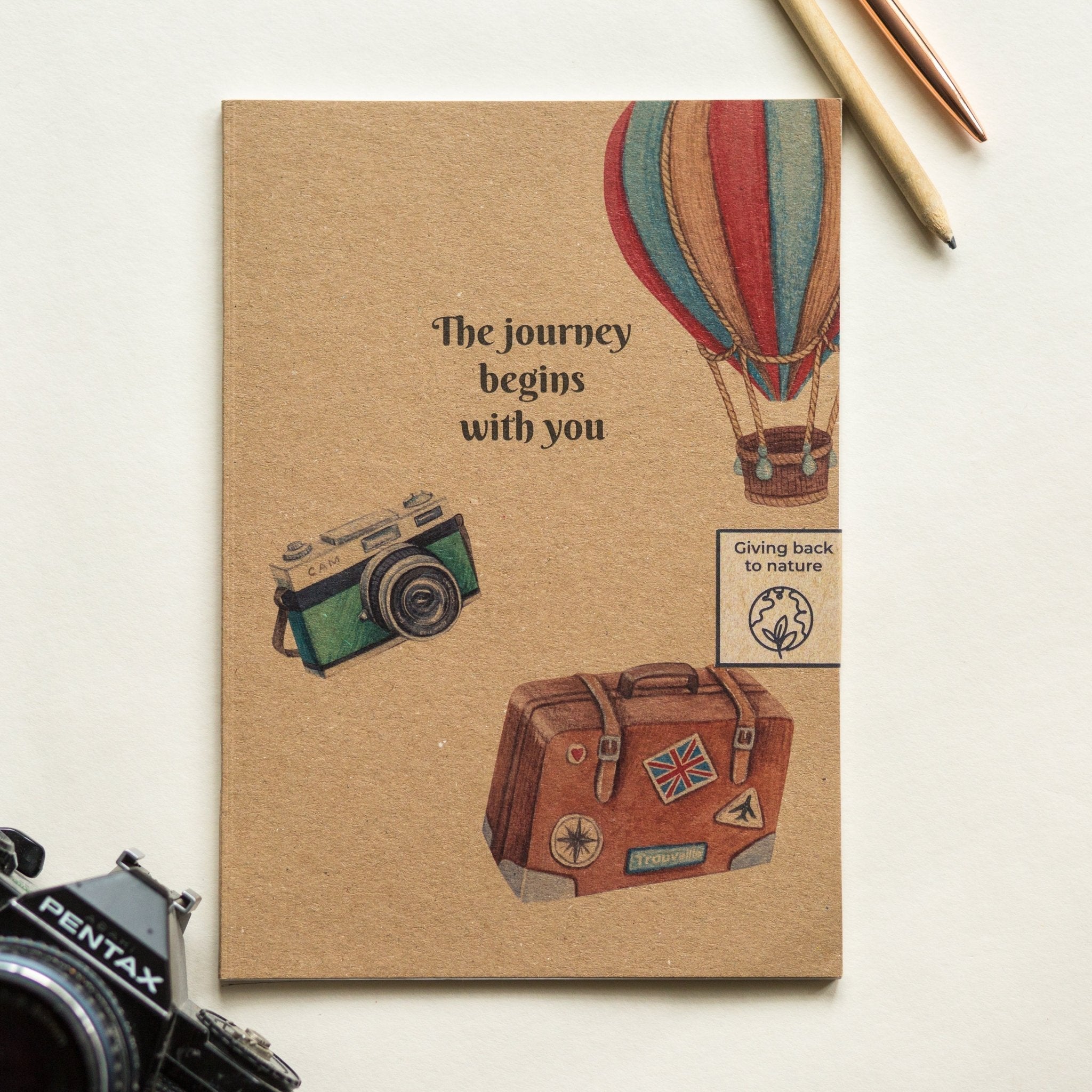 Trouvaille recycled paper notebook with illustrated vintage travel cover, perfect for journaling or note-taking.