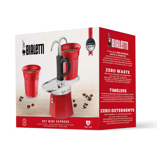 Red Bialetti Mini Express double serve espresso maker with two cups for homemade coffee brewing.