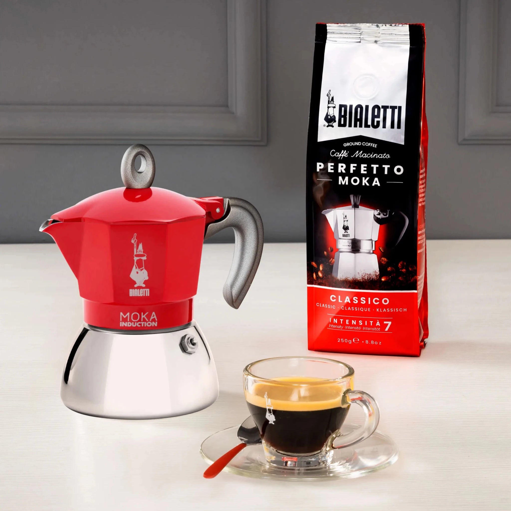 Red Bialetti Moka induction stovetop coffee maker by Brew Italia, featuring a classic design for brewing rich espresso-style coffee.