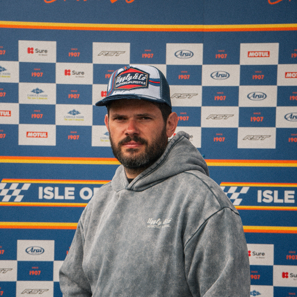 Retro blue and red diamond pattern trucker cap by Uggly and Co, featuring a classic mesh design and adjustable snapback.