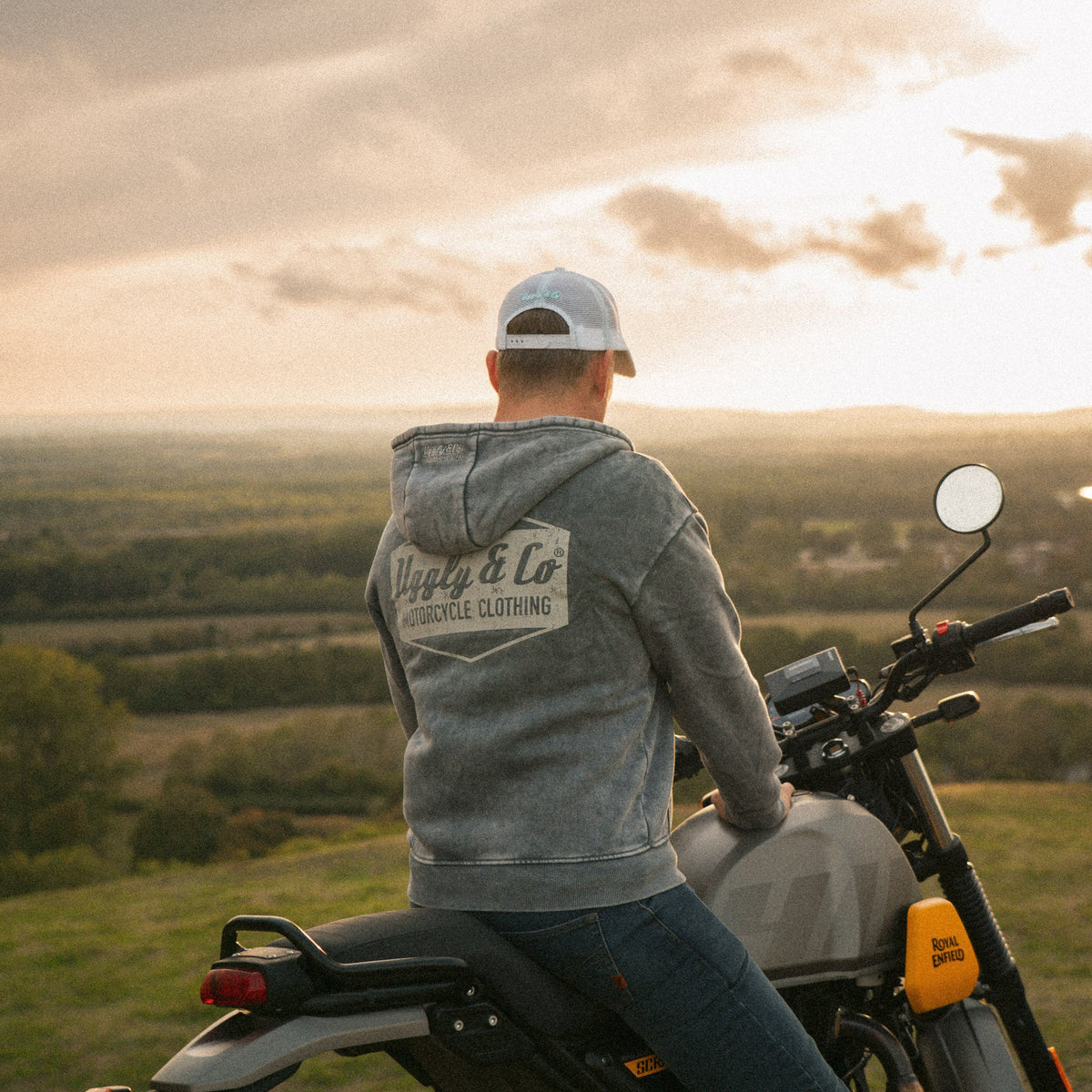 Turquoise and white diamond-patterned Uggly and Co trucker cap featuring a retro motorcycle rider lifestyle design.