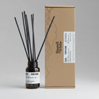 Russell + White Oud Fortune 100ml Reed Diffuser with natural rattan reeds and elegant glass bottle for home fragrance.