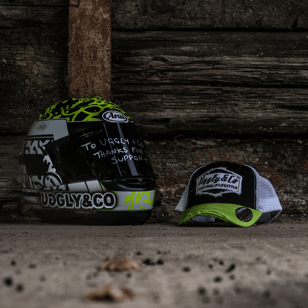 Yellow and white diamond trucker cap by Uggly and Co featuring mesh back and adjustable strap.