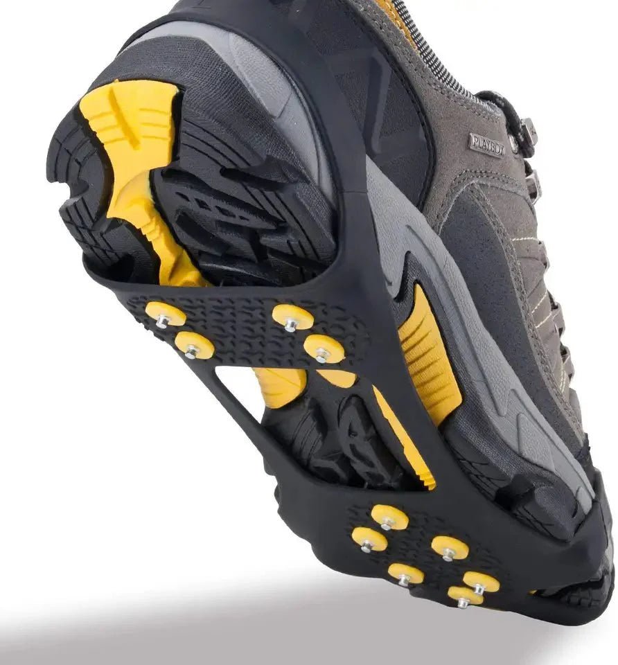 HikeWare silicone ice crampons with 10 steel studs attached to climbing shoes for enhanced grip on ice and snow surfaces.