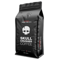 Ground beans of Skull Crusher Coffee's high caffeine Skull Crusher coffee in a clear bag, ready for brewing.