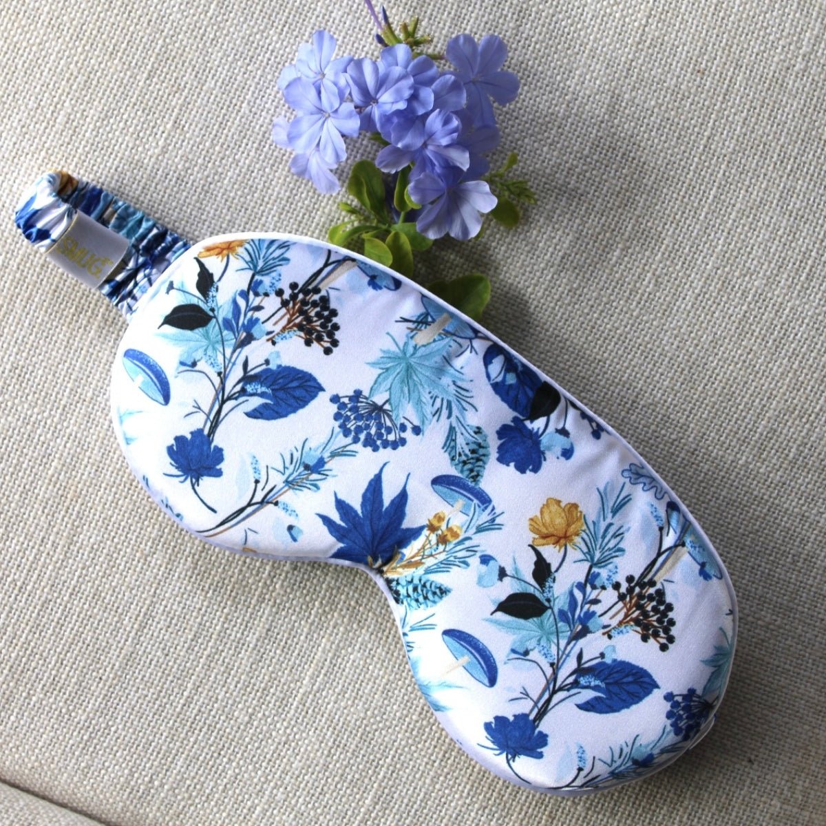 SMUG cloud padded satin sleep mask in cornflower print, designed for comfortable, restful sleep with a soft, luxurious fabric.