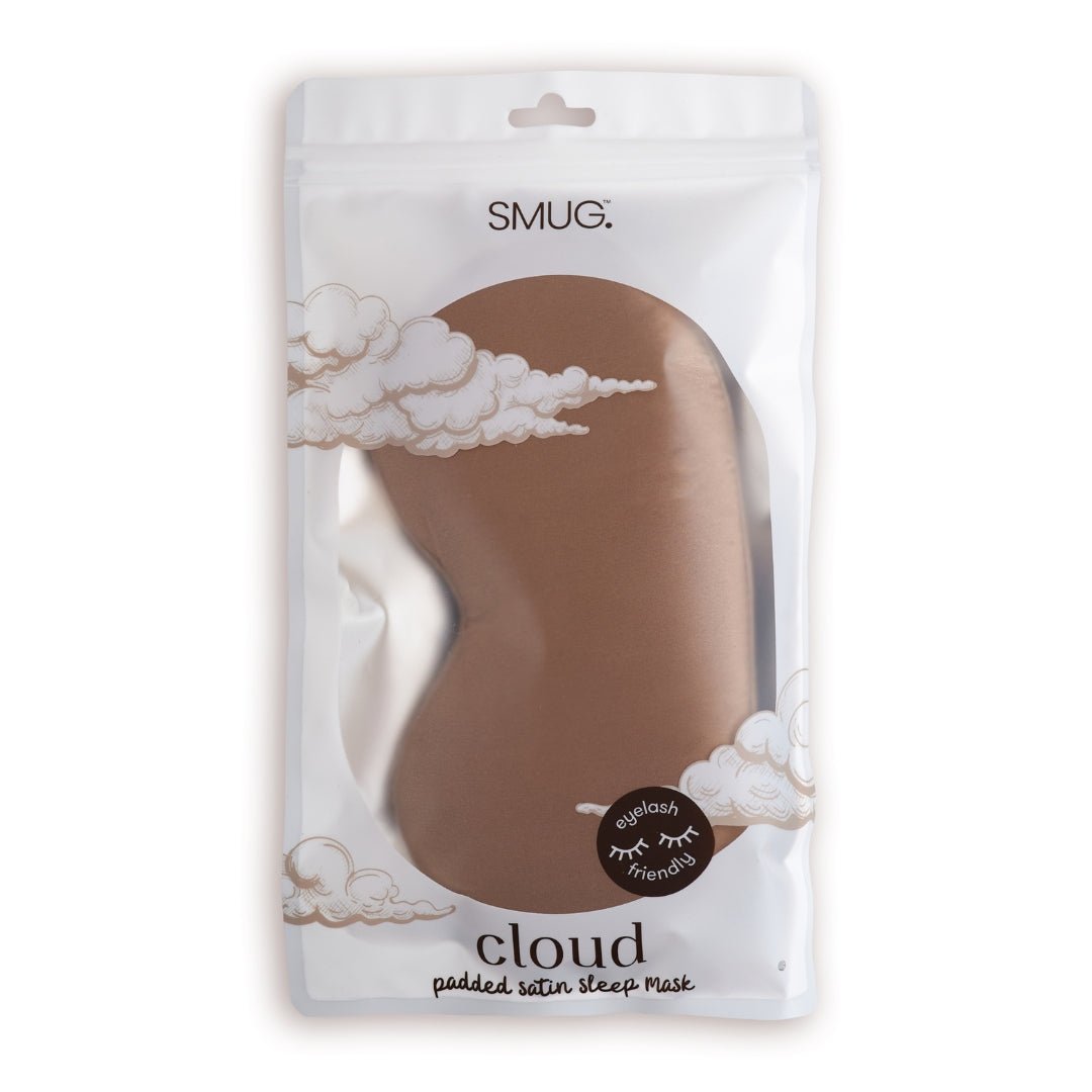 SMUG Cloud Padded Satin Sleep Mask in Mocha resting on packaging, showcasing soft satin fabric and plush cloud design for sleeping comfort.