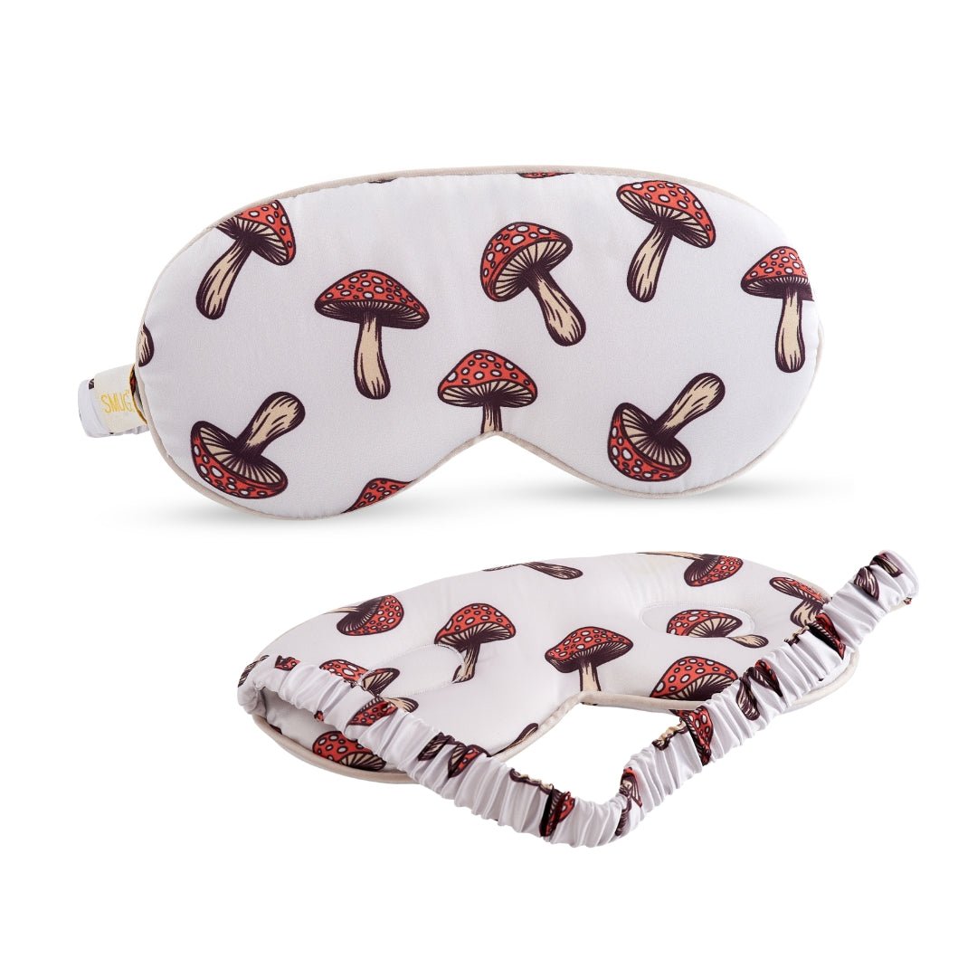 SMUG cloud padded satin sleep mask with a charming toadstool print, designed for comfortable, restful sleep.