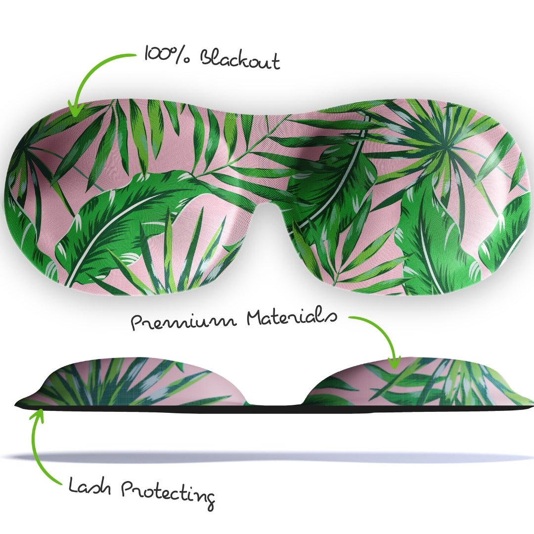 Contoured 3D blackout sleep mask by SMUG featuring green and pink palm tree leaf print for comfortable sleep.